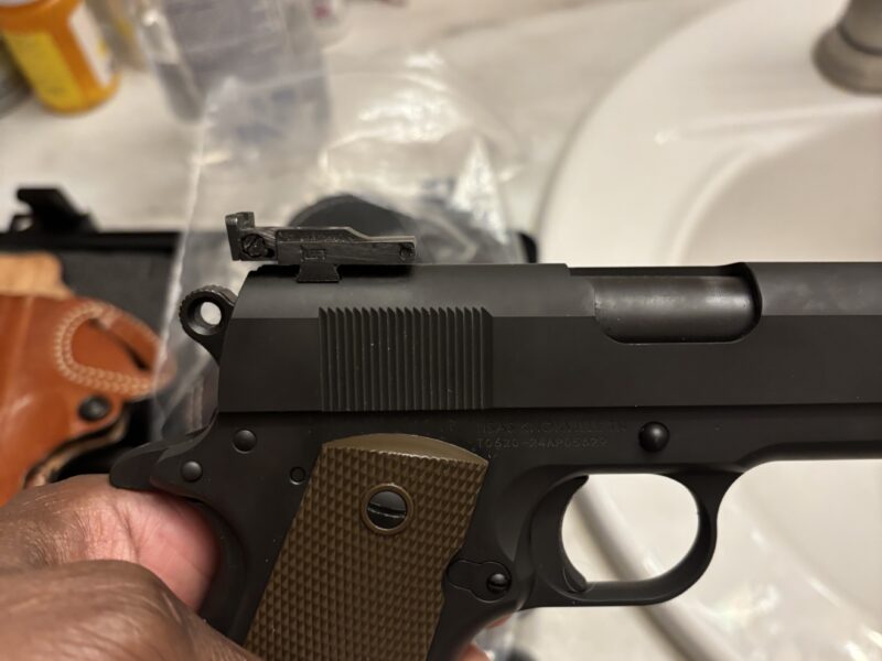 1911 Tisas with trijicon sites and 2 holsters