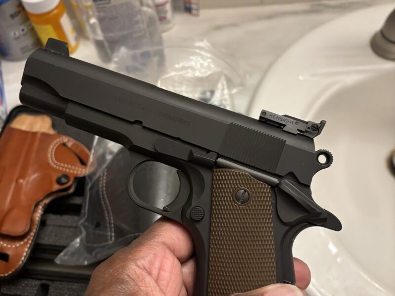 1911 Tisas with trijicon sites and 2 holsters